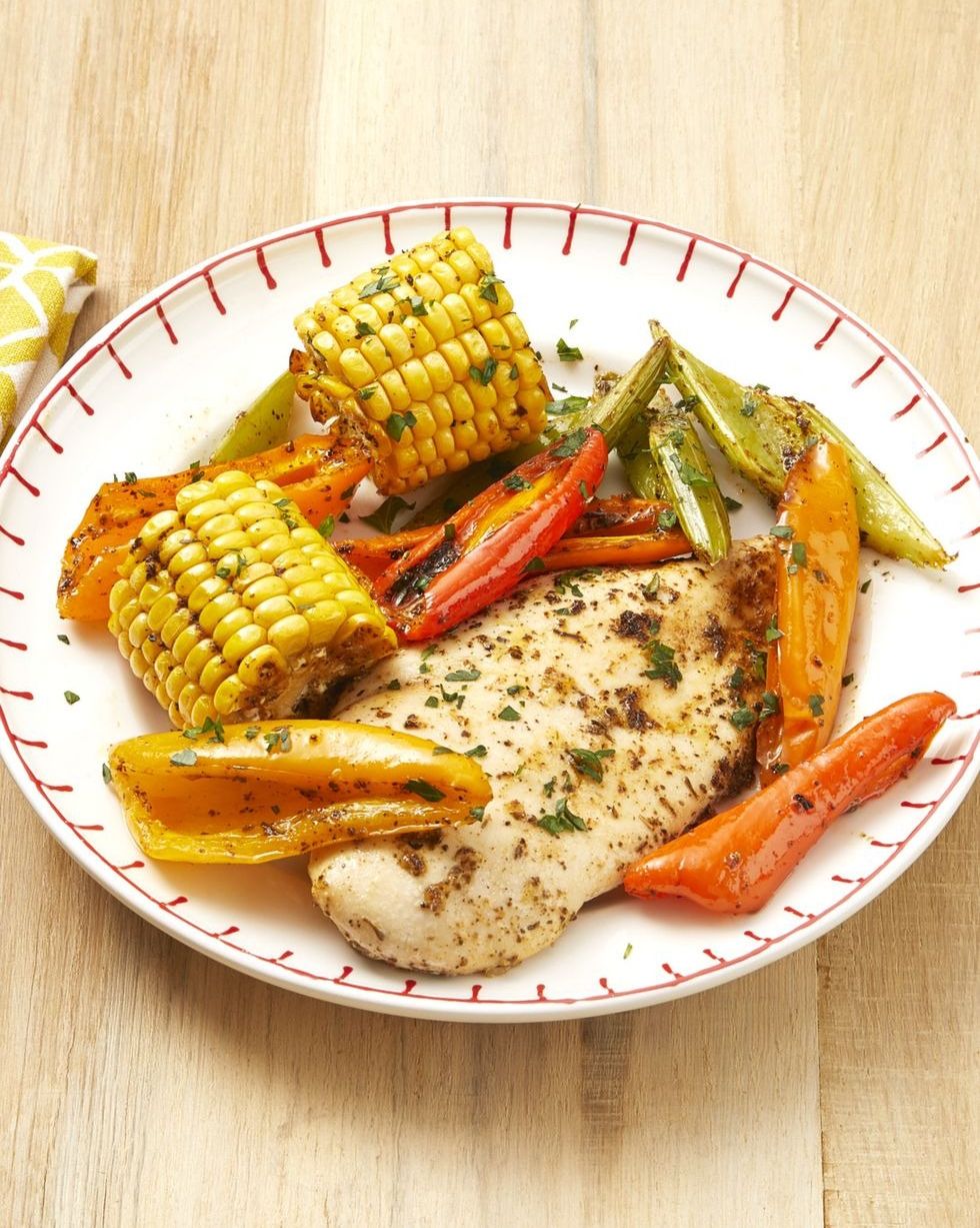 cajun chicken and corn with peppers on plate