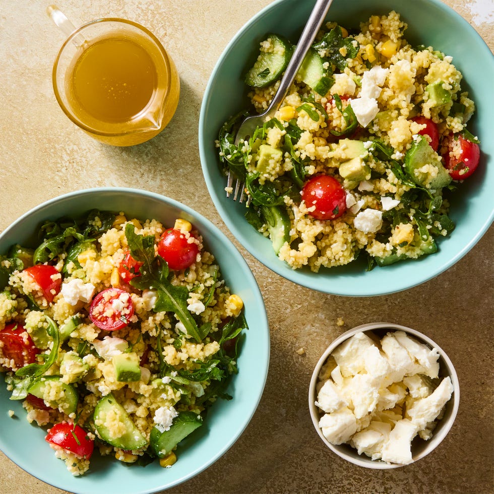 summer couscous salad with cucumber, tomato, avocado, and feta