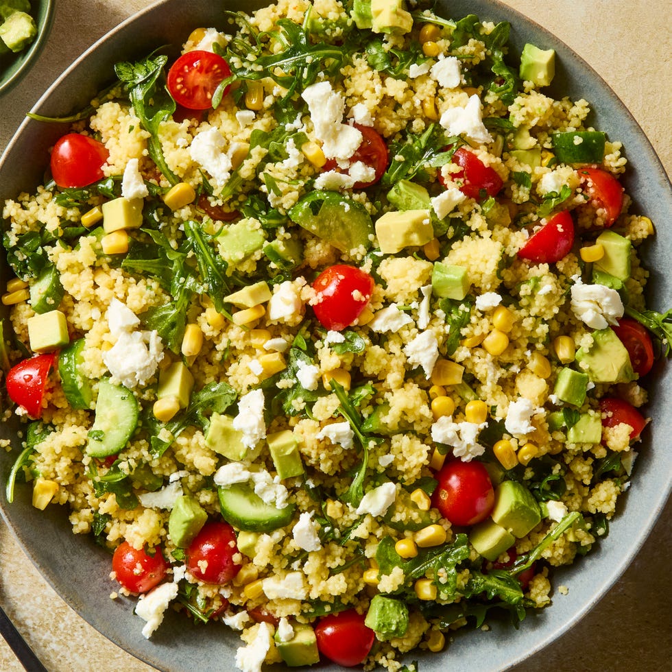 summer couscous salad with cucumber, tomato, avocado, and feta