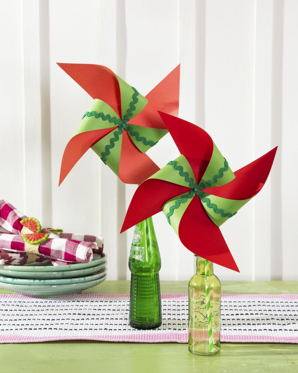 paper pinwheels crafted from red and green paper for a summery watermelon color scheme