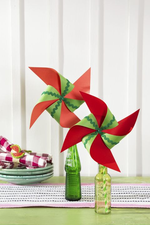 paper pinwheels crafted from red and green paper for a summery watermelon color scheme