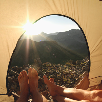 summer date ideas, couple in tent, couple camping