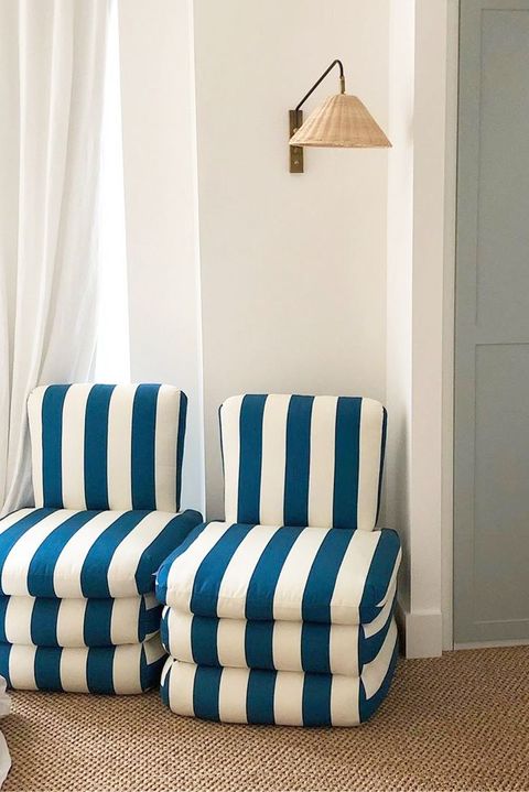 living room corner with striped blue and white chairs
