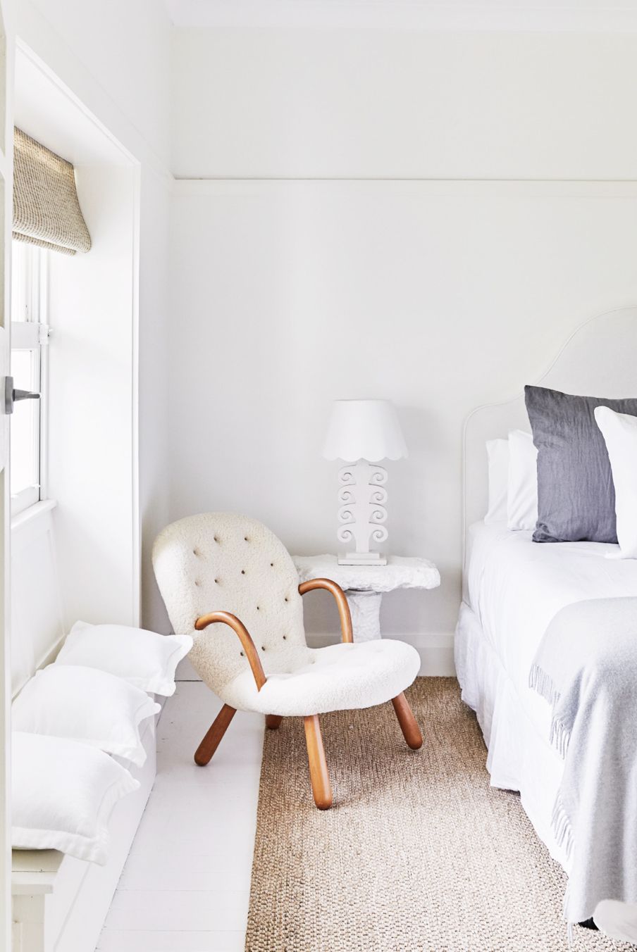 contemporary white bedroom with coastal decor