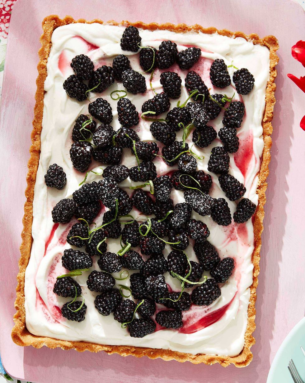 rectangle blackberry coconut tart topped with fresh blackberries and lime zest