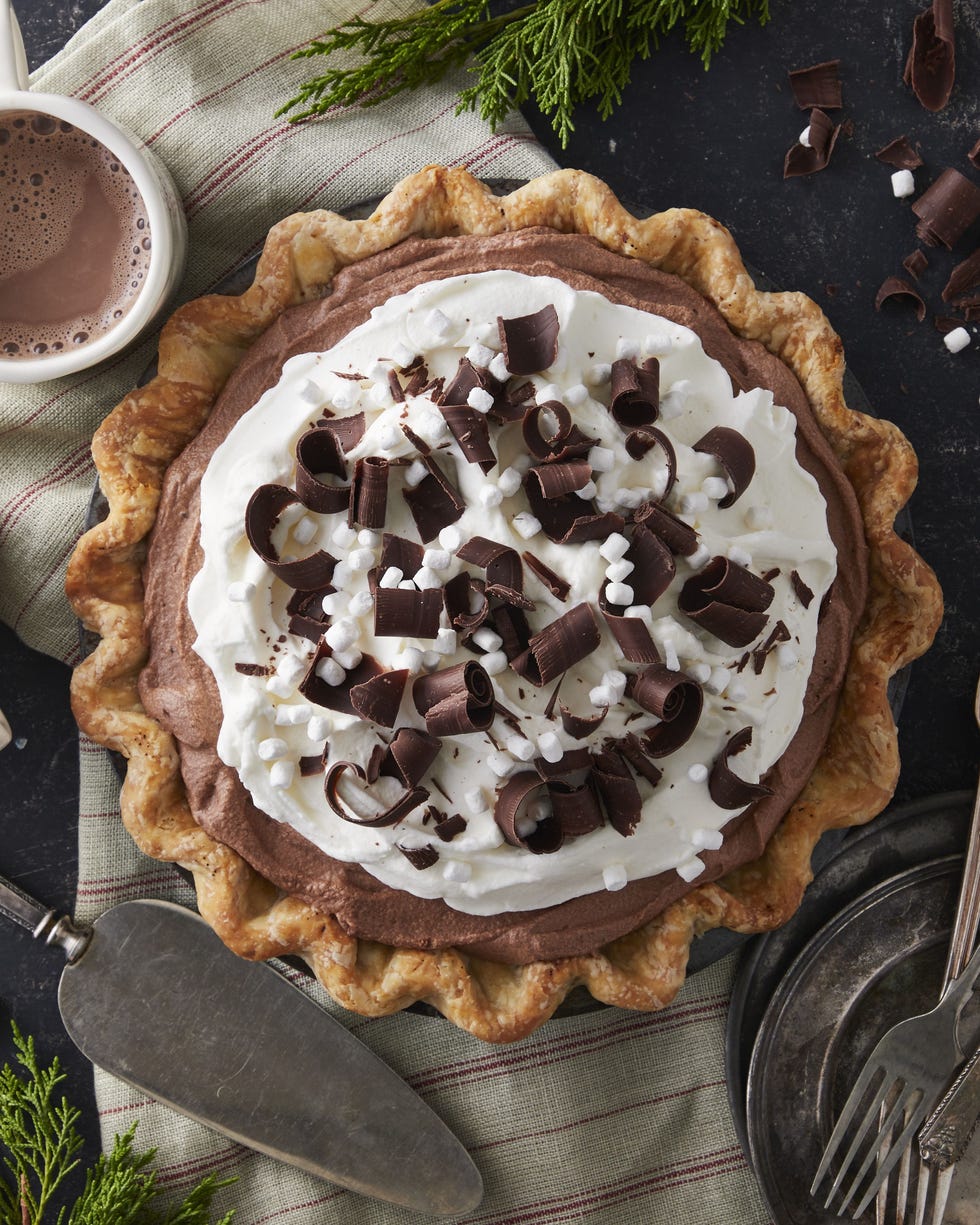 hot chocolate icebox pie topped with whipped cream chocolate curls and mini marshmallows