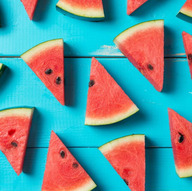 summer foods  slices of watermelon on blue picnic table