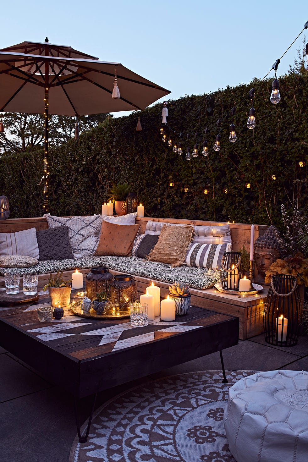 a table with candles and a table with a group of candles on it