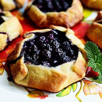mini blueberry galettes with mint sprig