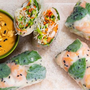 rice paper rolls filled with noodles, veggies, and shrimp and served with a peanut dipping sauce