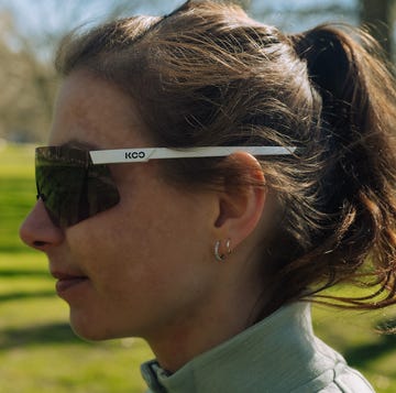 a woman looking to the side wearing a pair of large sunglasses a woman looking to the side wearing a pair of large sunglasses