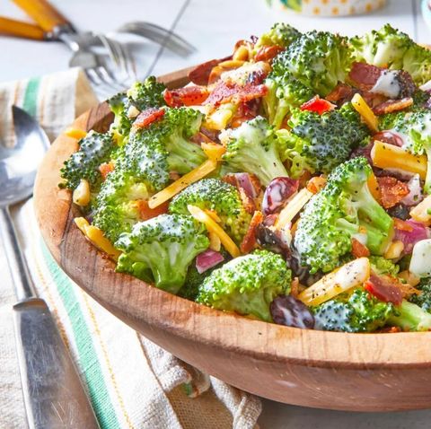 broccoli salad with cheddar cheese in wood bowl