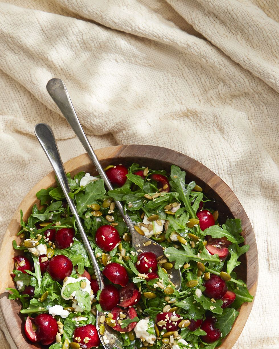 cherry, arugula, and goat cheese salad with toasted seeds