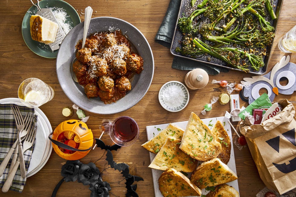 slow cooker spinach and parmesan meatballs piled on a metal serving tray