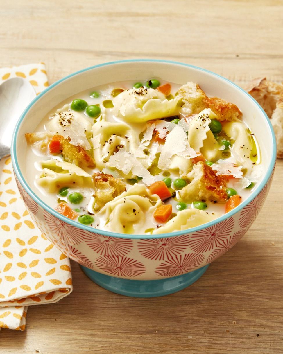 creamy tortellini soup in pw red and blue bowl