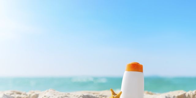 Summer time on the beach with sunblock.