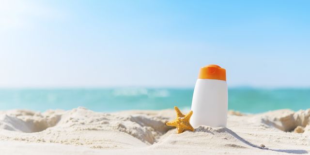 Summer time on the beach with sunblock.