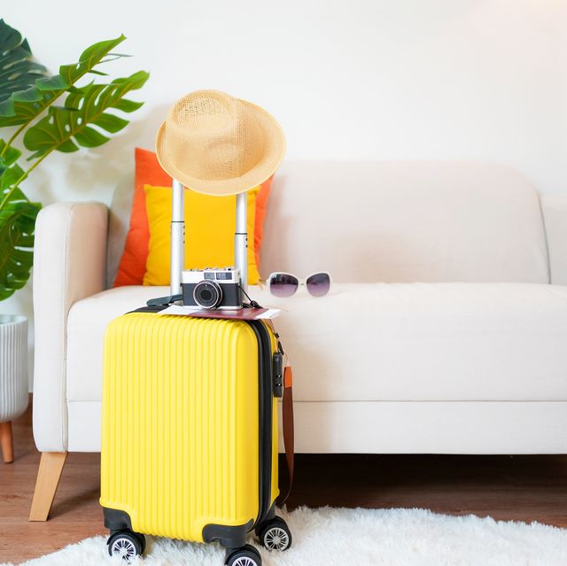 summer travel and planing with yellow suitcase luggage for trip travel in the holiday trips summer and travel concept