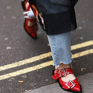 a person wearing red shoes