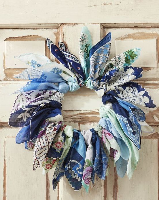 a wreath made from vintage blue handkerchiefs tied around a wire wreath form