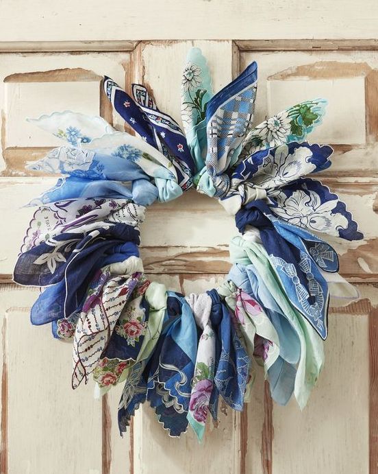 a wreath made from vintage blue handkerchiefs tied around a wire wreath form
