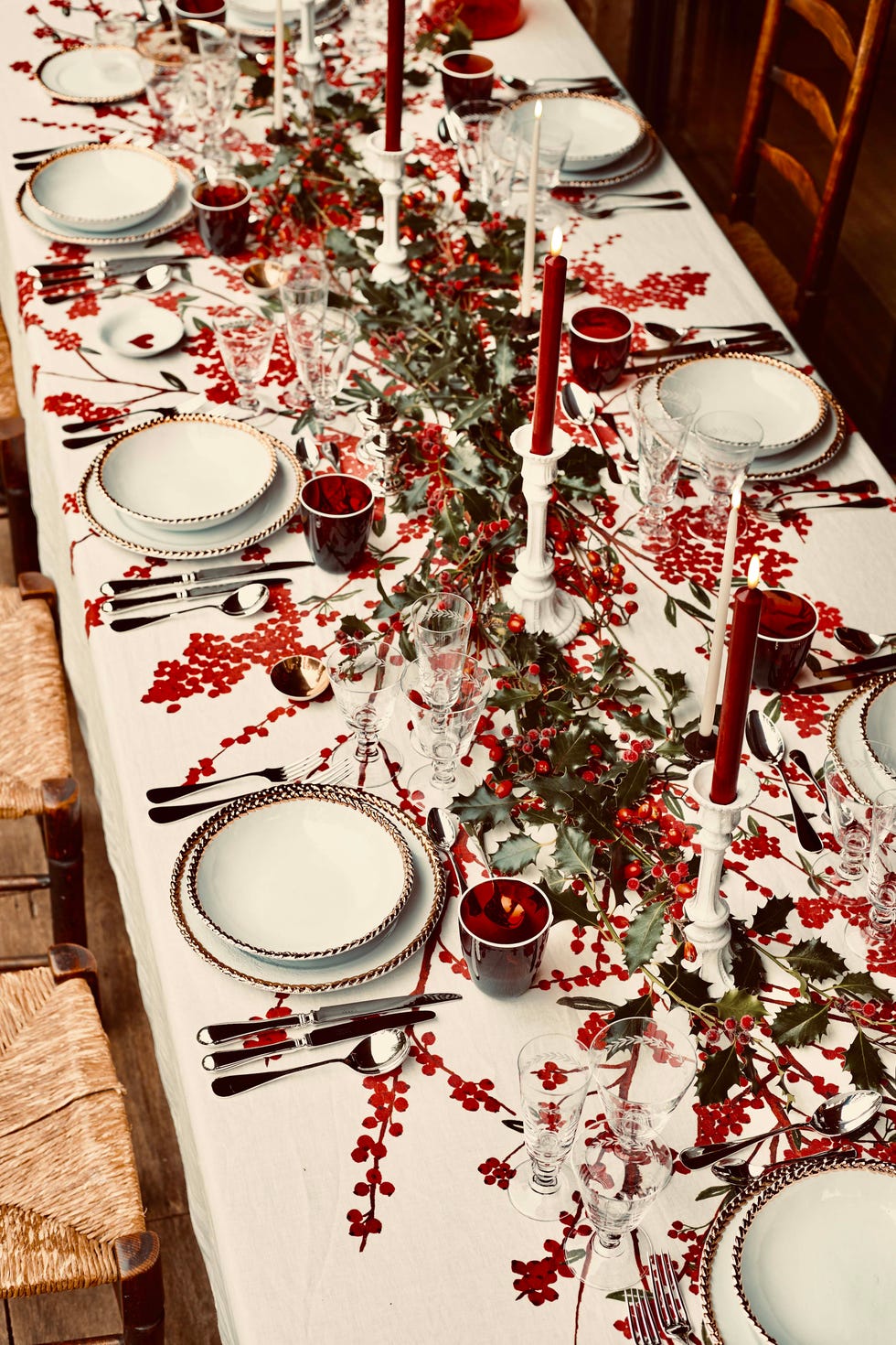 a festive dining table set with elegant tableware and holiday decorations