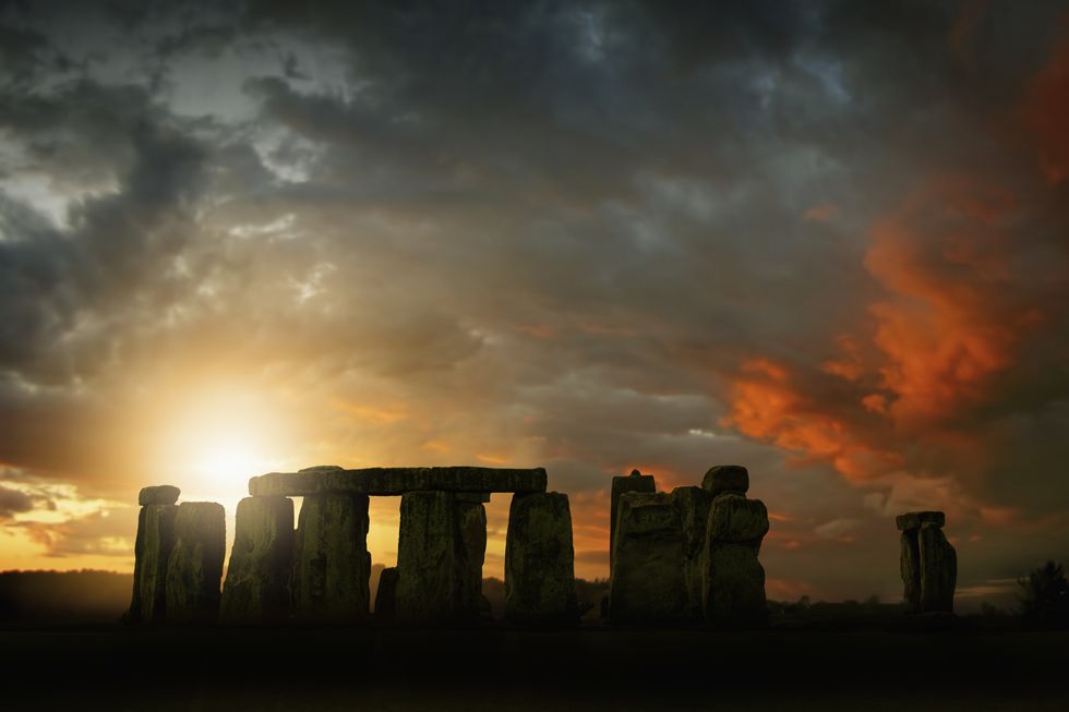 Sun rising over Stonehenge, Wiltshire, United Kingdom