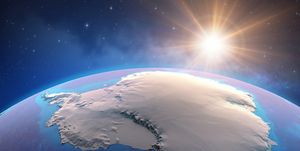 sun shining over antarctica from space