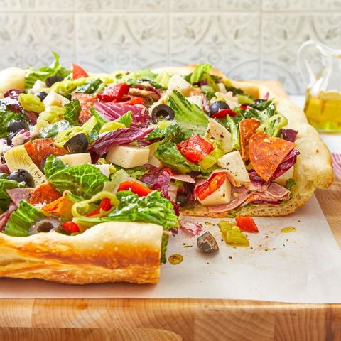 salad pizza on wood board