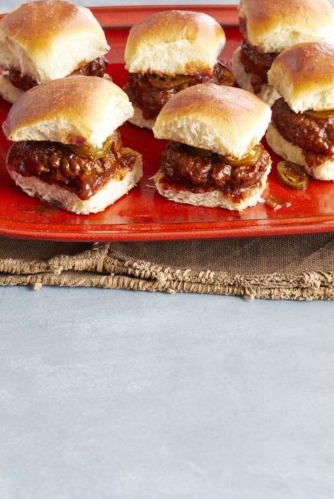 spicy whiskey bbq sliders on red platter