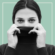 woman covering half of her face with a turtleneck woman covering half of her face with a turtleneck