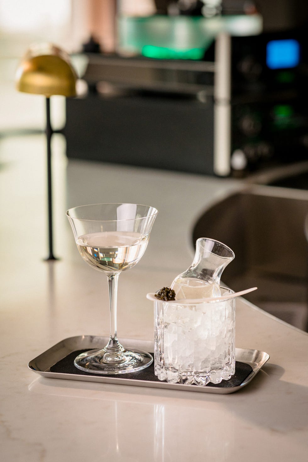 two glasses of liquid on a table
