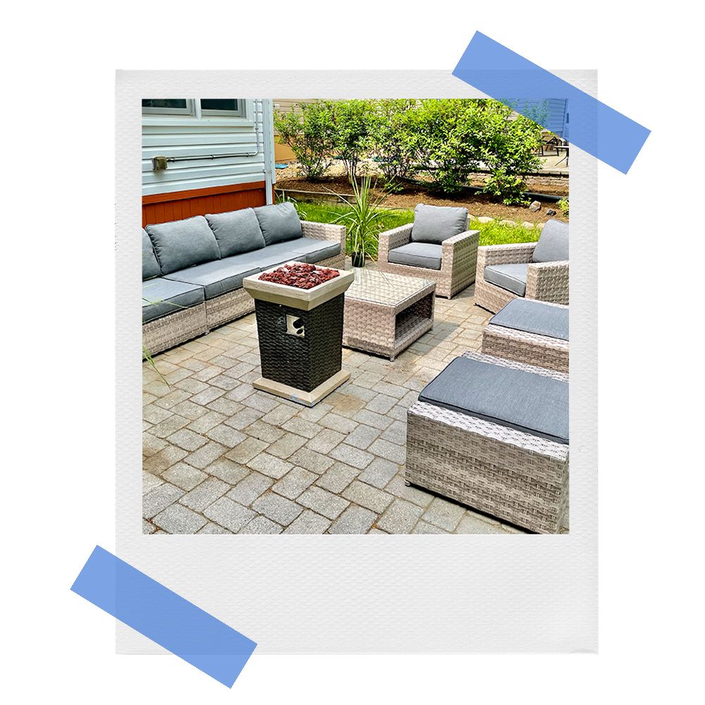 sunhaven outdoor sofa chairs ottoman and fire pit on backyard patio