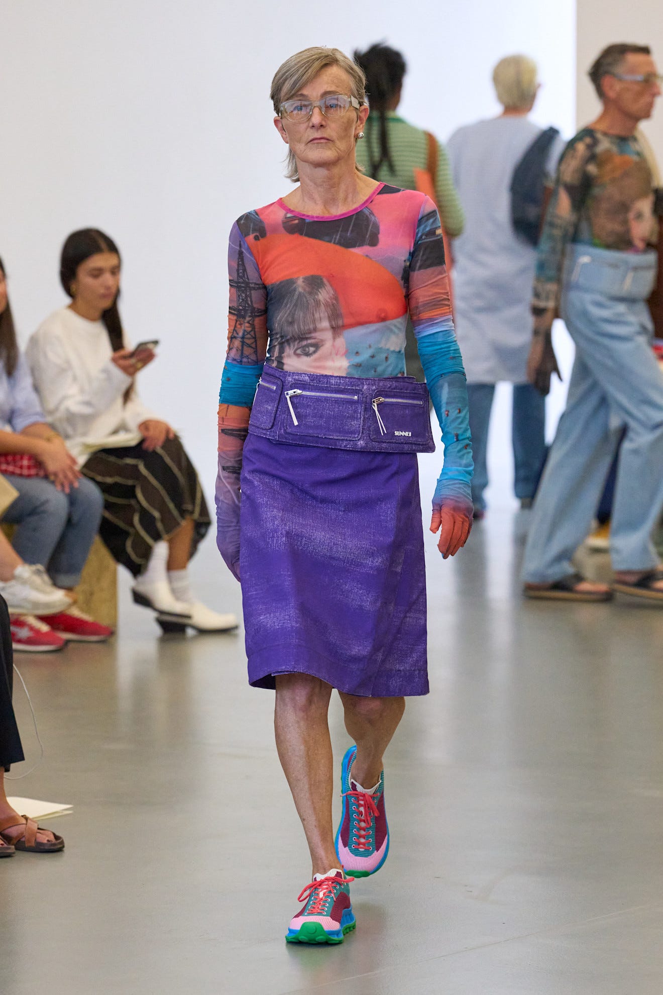 Fashion model showcasing a vibrant outfit on the runway