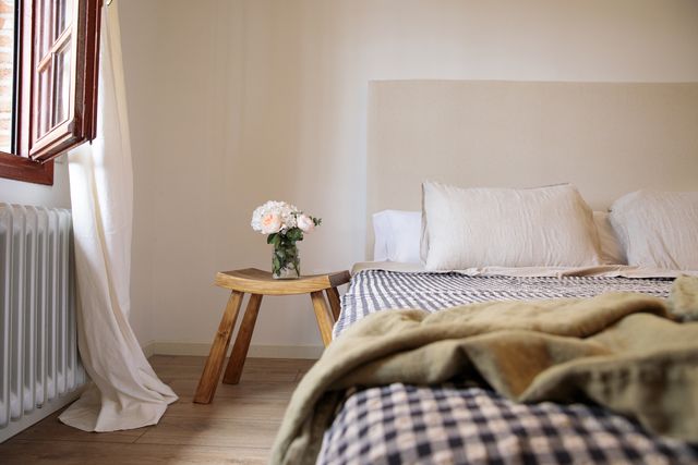 sunny window in the room with bed