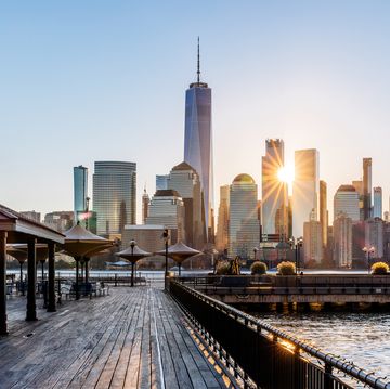sunrise in new york city seen from the pier in jersey city, usa