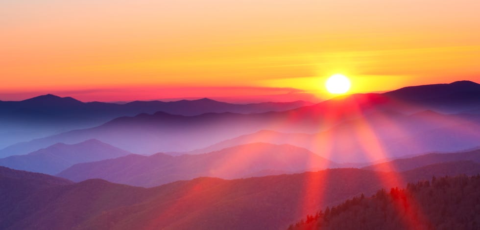 Sunset on a foggy mountain range