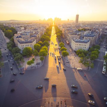 sunset with golden color over the city of paris , france