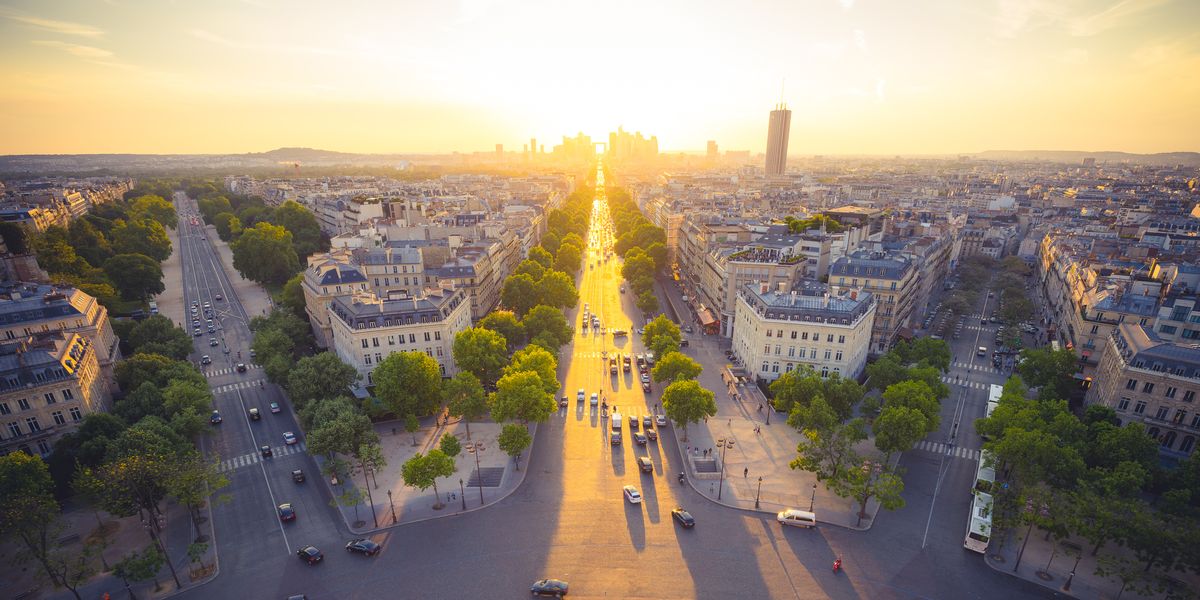 sunset with golden color over the city of paris , france