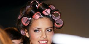 supermodel adriana lima with her hair in curlers backstage b
