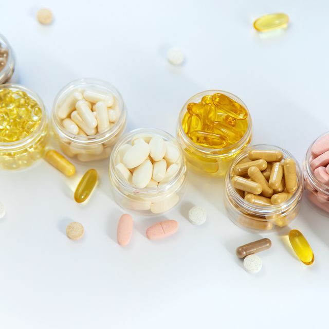 supplements and vitamins on a white background selective focus