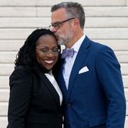 supreme court justice ketanji brown jackson receives a kiss from her husband, dr patrick jackson