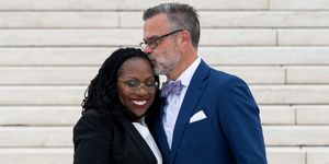 supreme court justice ketanji brown jackson receives a kiss from her husband, dr patrick jackson