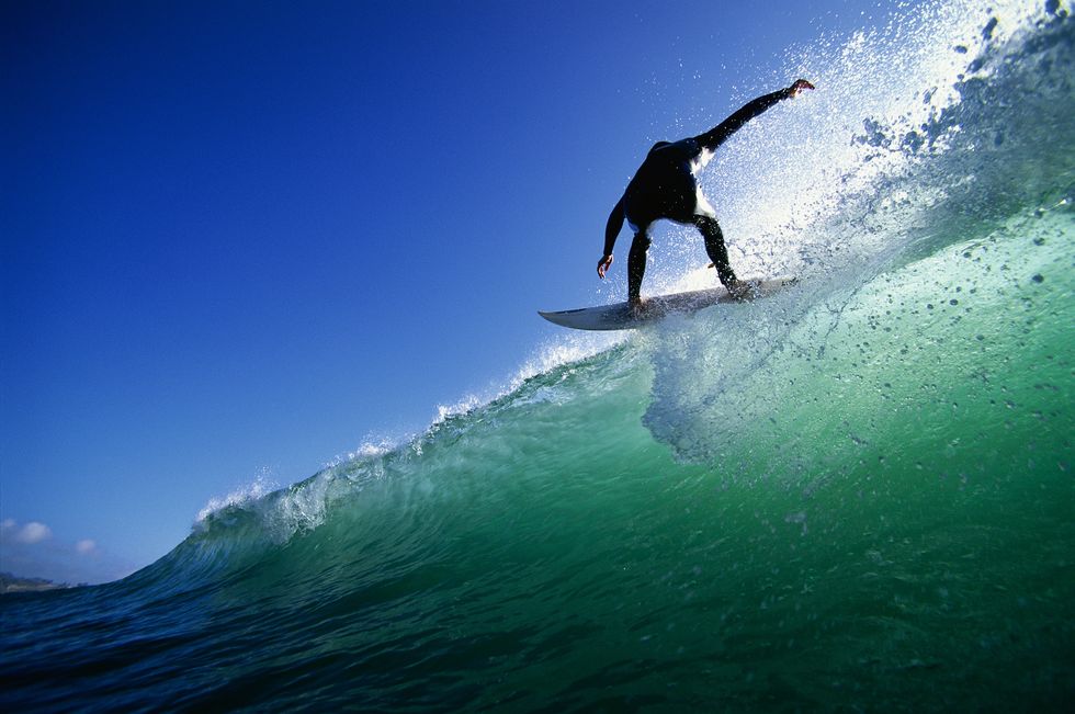 surfer on top of wave