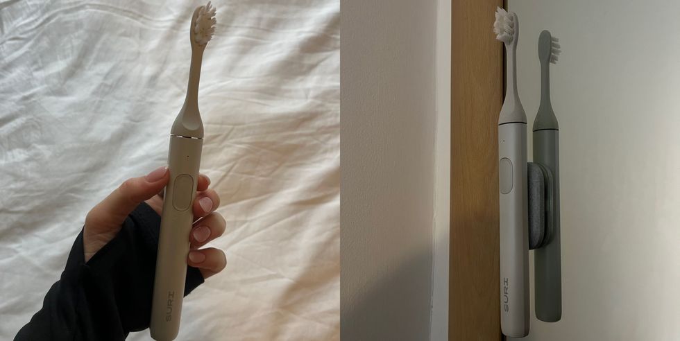 a person holds a toothbrush