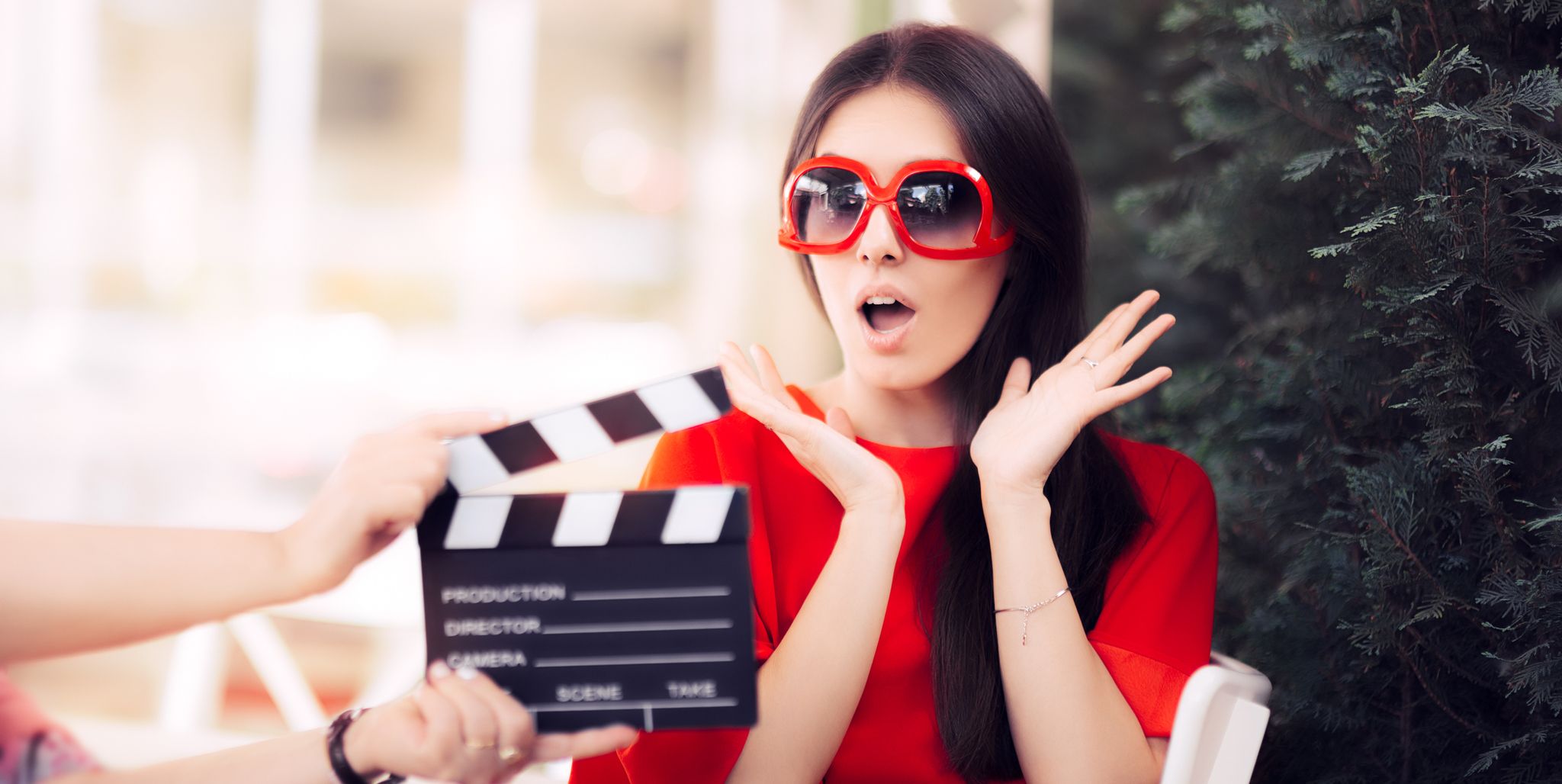 Surprised Actress with Oversized Sunglasses Shooting Movie Scene