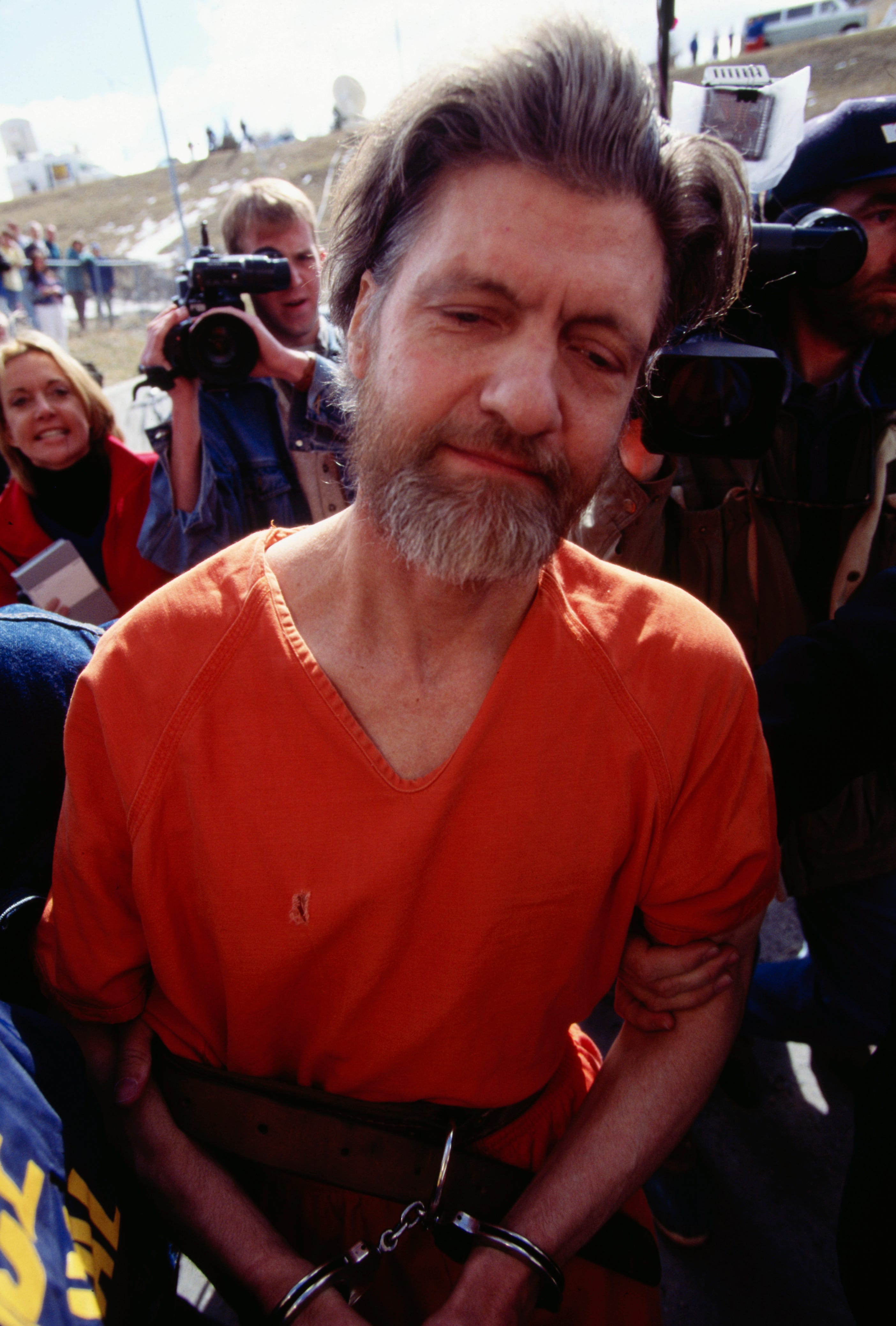ted kaczynski in handcuffs walking to a court arraignment