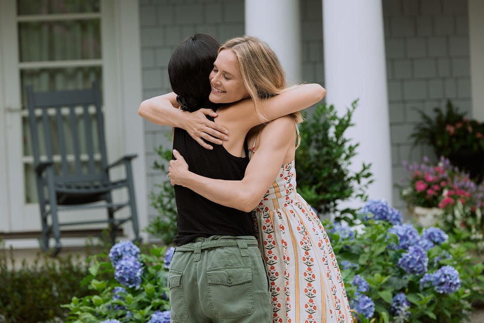 two people embracing in a garden setting