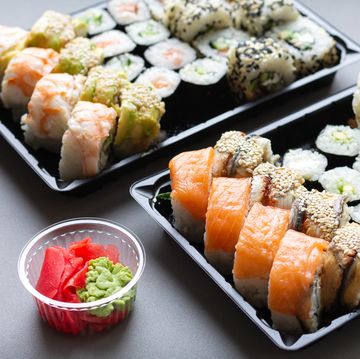 sushi roll in plastic box for take away background