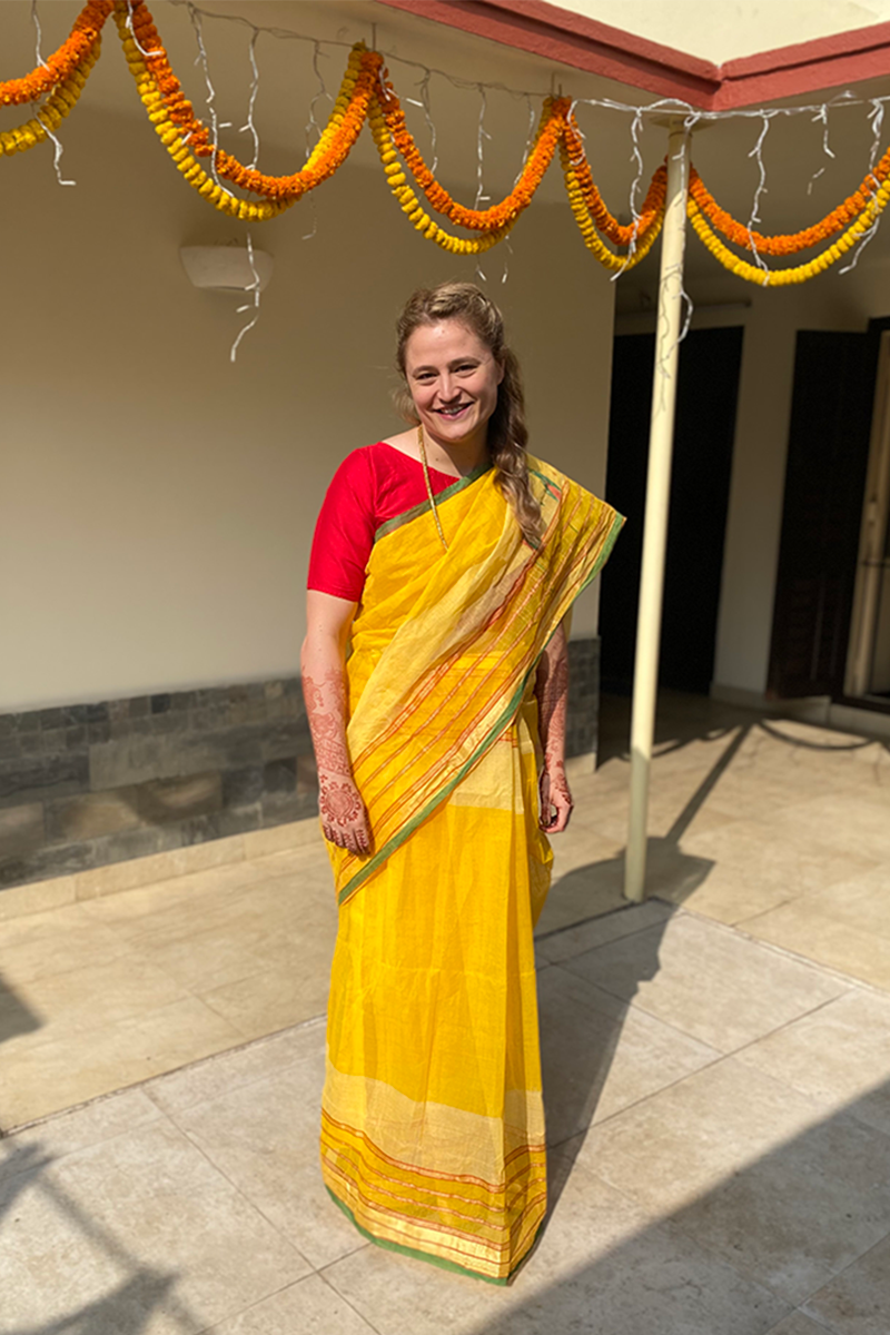 the bride during the gaye holud wearing a yellow sari